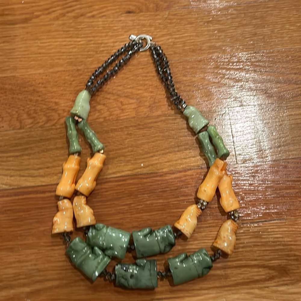 Vintage bead necklace with orange and green beads.